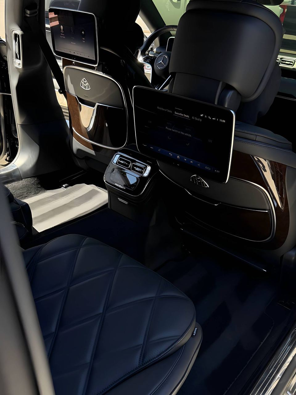 Mercedes-Maybach S-Class rear cabin with diamond-stitched leather and entertainment screens