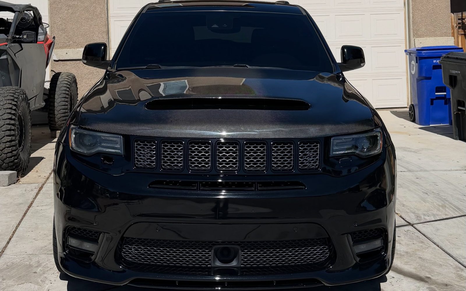 An SUV kept clean in the driveway on a maintenance program