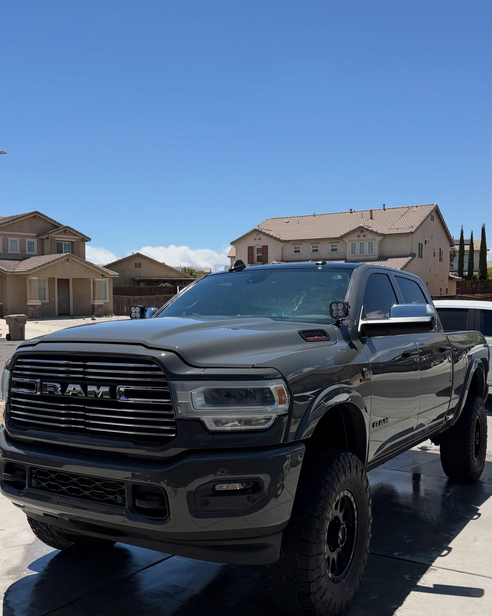 A maintained vehicle being hand washed on a residential driveway