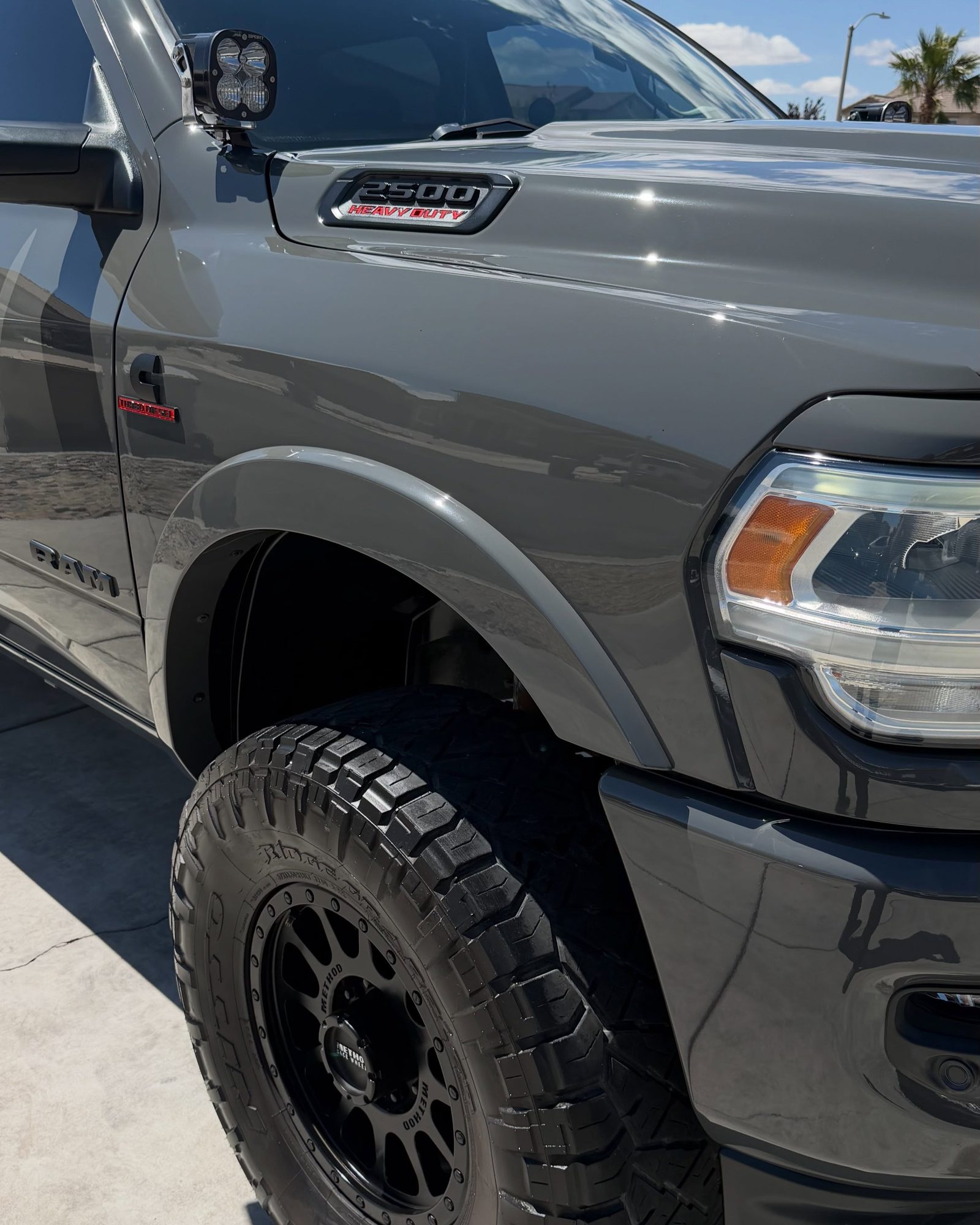 A maintained vehicle being hand washed on a residential driveway