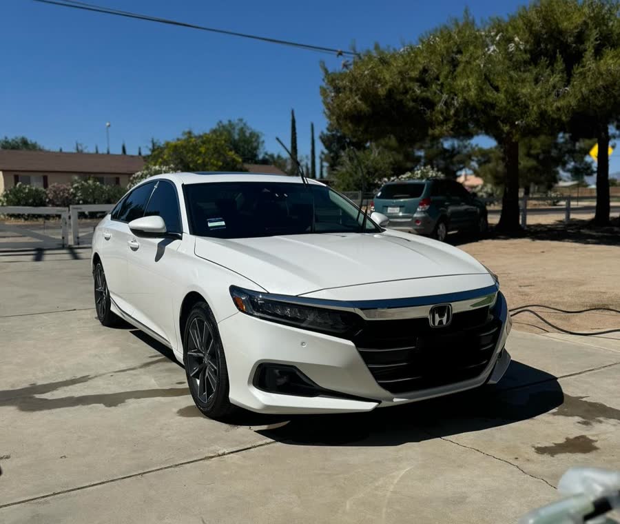 A white Honda Accord kept clean in a High Desert driveway