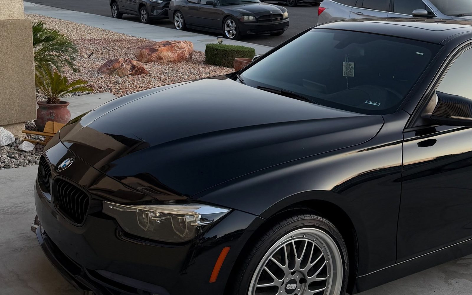 A glossy black sedan panel reflecting cleanly after paint correction