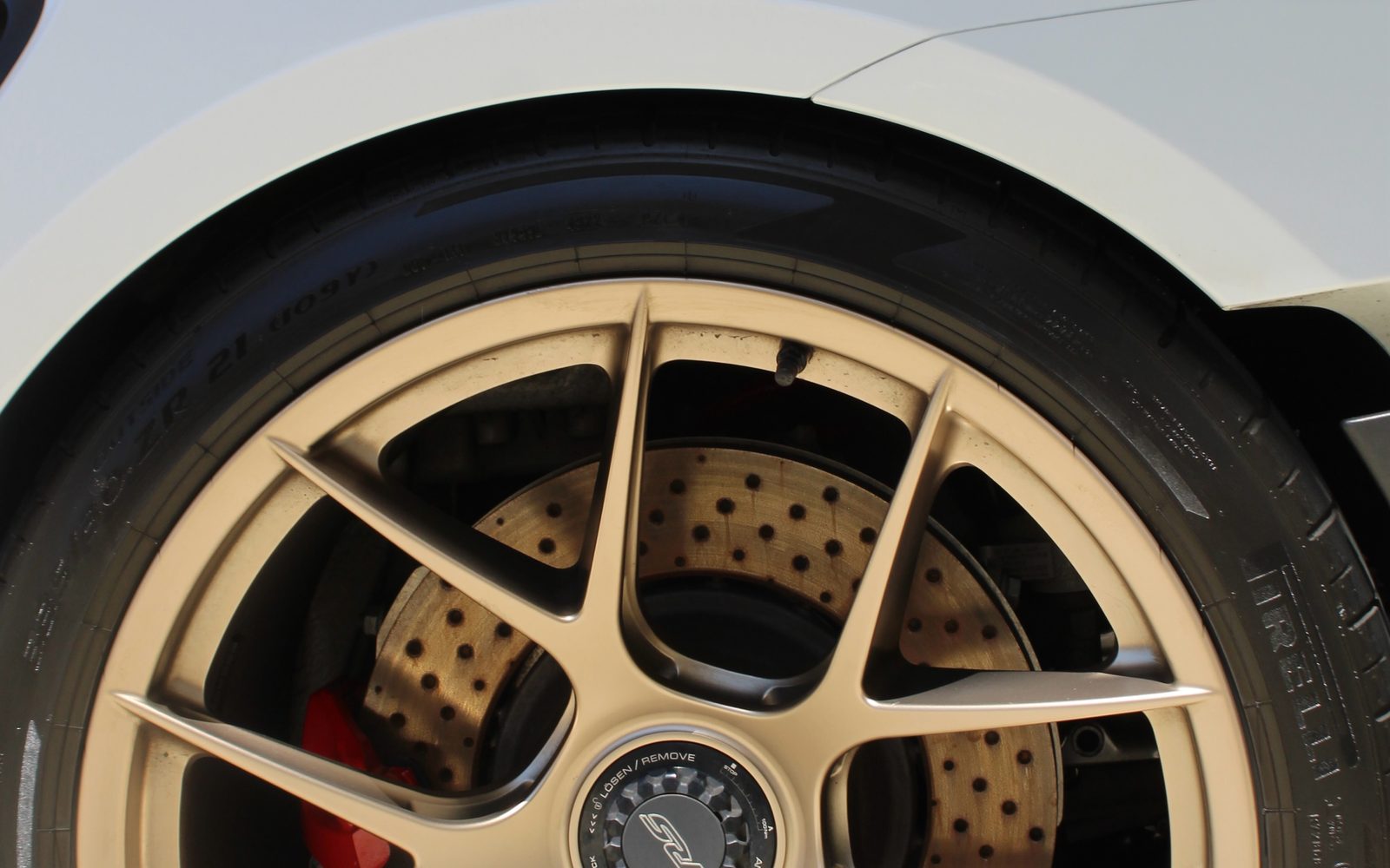 A wheel and brake caliper detailed and finished with a ceramic coating