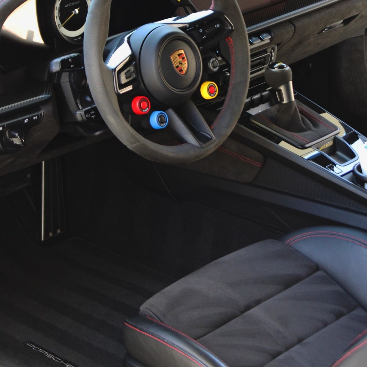 The alcantara interior of a Porsche 911 GT3 RS mid detail
